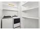 Convenient laundry room with shelving over the washer and dryer at 721 Meeting St, Charleston, SC 29403
