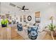 Bright living room featuring shiplap walls, hardwood floors, and open layout at 721 Meeting St, Charleston, SC 29403