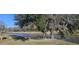 Scenic community view featuring waterfront access with a picnic area and mature trees draped in Spanish moss at 7646 Kinston St, North Charleston, SC 29418