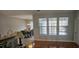 Open concept dining area with plenty of light, seamlessly connecting the kitchen and living spaces, perfect for gatherings at 7646 Kinston St, North Charleston, SC 29418