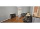 Cozy living room with comfortable seating, hardwood floors, and stylish decor, perfect for relaxing or entertaining at 7646 Kinston St, North Charleston, SC 29418