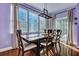 Dining room boasts hardwood floors, natural light, and a classic wooden table at 9024 Parlor Dr, Ladson, SC 29456