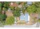 Aerial view of property highlighting the home, yard, nearby road and a truck with trailer at 907 Pauline Ave, Charleston, SC 29412