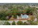 An aerial view of a charming single-story home with a fenced yard and mature trees, with the property line highlighted at 907 Pauline Ave, Charleston, SC 29412
