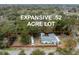 An aerial view of the home on an expansive .52 acre lot surrounded by mature trees at 907 Pauline Ave, Charleston, SC 29412