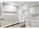 Modern bathroom featuring white marble, a glass-enclosed shower, and a new vanity at 907 Pauline Ave, Charleston, SC 29412
