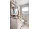A lovely bathroom features a nice mirror, vanity, granite countertop, and a toilet at 907 Pauline Ave, Charleston, SC 29412