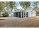 Charming home exterior with screened-in porch, shed, and well-maintained yard offers outdoor space at 907 Pauline Ave, Charleston, SC 29412