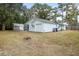 View of home's exterior with a shed and garage, enhancing curb appeal and functionality at 907 Pauline Ave, Charleston, SC 29412