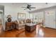 Stylish living area with hardwood floors, comfortable sofa, and decorative elements, creating a warm ambiance at 907 Pauline Ave, Charleston, SC 29412