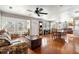 Expansive living area boasts an open floor plan, hardwood floors, large windows, and great natural light at 907 Pauline Ave, Charleston, SC 29412