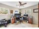 Bright home office with large windows and a ceiling fan creates a comfortable workspace at 907 Pauline Ave, Charleston, SC 29412