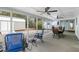 Inviting screened porch with comfortable seating and dining area for enjoying outdoor living at 907 Pauline Ave, Charleston, SC 29412