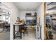 Well-equipped workshop with workbench, shelving, and epoxy floor, ideal for hobbies and projects at 907 Pauline Ave, Charleston, SC 29412