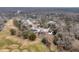 Aerial view of a peaceful neighborhood next to a golf course, showcasing lush, mature trees and landscaping at 101 S Gateshead Crossing, Goose Creek, SC 29445