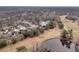 Aerial view of a residential neighborhood next to a golf course with a pond on a cloudy day at 101 S Gateshead Crossing, Goose Creek, SC 29445