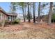 Spacious backyard featuring mature trees, a wooden swing, and a glimpse of the house's screened porch at 101 S Gateshead Crossing, Goose Creek, SC 29445