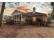 View of a brick home with a screened-in porch overlooking a large backyard and mature trees at 101 S Gateshead Crossing, Goose Creek, SC 29445