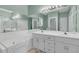 Bathroom featuring double vanity, a tub, a large mirror, and updated finishes at 101 S Gateshead Crossing, Goose Creek, SC 29445