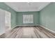 Spacious bedroom features wood floors, recessed lighting, and a window overlooking the backyard at 101 S Gateshead Crossing, Goose Creek, SC 29445