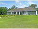 Exterior view of the community clubhouse on a large manicured lawn with a covered front entrance at 101 S Gateshead Crossing, Goose Creek, SC 29445