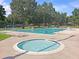 A community pool area features a large pool, hot tub, lounge chairs, and lifeguard stand at 101 S Gateshead Crossing, Goose Creek, SC 29445