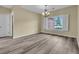 Bright dining room featuring wood floors, a chandelier, and a large window with plantation shutters at 101 S Gateshead Crossing, Goose Creek, SC 29445