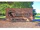 The 'Crowfield Golf Club' brick entrance sign with address is surrounded by mulch and mature trees at 101 S Gateshead Crossing, Goose Creek, SC 29445
