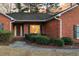 Charming brick home featuring a warm and inviting entrance, complemented by manicured landscaping at 101 S Gateshead Crossing, Goose Creek, SC 29445