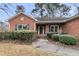 Inviting brick home with lush green shrubs and a well-maintained walkway leading to the entrance at 101 S Gateshead Crossing, Goose Creek, SC 29445