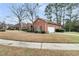 Detached brick garage with an automatic door, surrounded by a well-kept yard and landscaping at 101 S Gateshead Crossing, Goose Creek, SC 29445