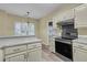 Modern kitchen with stainless steel oven and light countertops; the design is complemented by the natural light in the eating area at 101 S Gateshead Crossing, Goose Creek, SC 29445