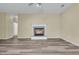 Living room featuring a traditional fireplace, neutral wall color and a seamless transition to adjacent rooms with matching wood flooring at 101 S Gateshead Crossing, Goose Creek, SC 29445