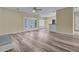 Open living area with modern wood floors, white trim, and French doors leading to the outdoors at 101 S Gateshead Crossing, Goose Creek, SC 29445