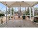 Spacious screened porch with wood floors, ceiling fan, and views of the backyard and mature trees at 101 S Gateshead Crossing, Goose Creek, SC 29445