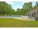 A spacious swimming pool with lounge chairs and clear blue water, perfect for relaxation and recreation on sunny days at 101 S Gateshead Crossing, Goose Creek, SC 29445