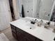 Bathroom sink with a dark wood vanity, featuring ample counter space and a large mirror at 110 Greyson Cir, Goose Creek, SC 29445