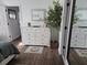 Bright bedroom includes a dresser, decorative mirror, and a potted tree, creating a cozy atmosphere at 110 Greyson Cir, Goose Creek, SC 29445