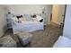 This guest bedroom is decorated with a daybed, pillows, and an ottoman; the perfect place to relax or unwind at 110 Greyson Cir, Goose Creek, SC 29445