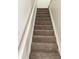 Carpeted stairs with white trim lead to the next level of the home at 110 Greyson Cir, Goose Creek, SC 29445