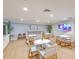 Inviting community space with comfortable seating, modern lighting, and a large TV for residents to enjoy at 1126 Ocean Blvd # 109116230, Isle of Palms, SC 29451