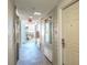 Hotel hallway featuring elevator, entrance door, and an inviting view to the outside at 1126 Ocean Blvd # 109116230, Isle of Palms, SC 29451