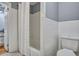 Bright bathroom featuring tiled walls, shower with curtain, and patterned flooring at 1228 Brookside Dr, Hanahan, SC 29410