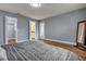Spacious bedroom featuring hardwood floors, a large closet, and soft gray walls at 1228 Brookside Dr, Hanahan, SC 29410