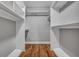 Walk-in closet with built-in shelving and hardwood floors, offering ample storage space at 1228 Brookside Dr, Hanahan, SC 29410