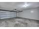 Spacious garage with a large sectional door and ample room for storage at 1228 Brookside Dr, Hanahan, SC 29410