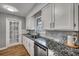 Bright kitchen features granite countertops, stainless steel appliances, white cabinets, and hardwood floors at 1228 Brookside Dr, Hanahan, SC 29410
