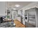 Modern kitchen featuring stainless steel appliances, granite countertops, and ample cabinet space at 1228 Brookside Dr, Hanahan, SC 29410