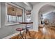 Cozy breakfast nook with a charming table and view to an outdoor screened-in porch and living room at 1228 Brookside Dr, Hanahan, SC 29410
