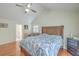 A bright bedroom with hardwood floors, vaulted ceiling, and a rustic bed frame at 131 Londonderry Rd, Goose Creek, SC 29445